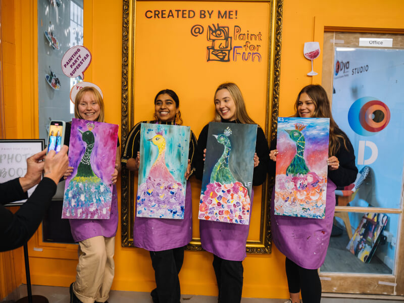 four girls at a paint and sip class